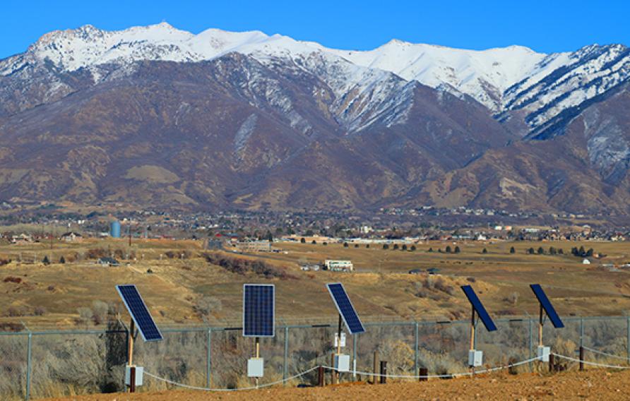 Solar panels in front of mountains