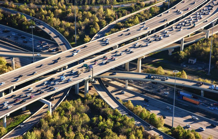 A grouping of freeways layered and curving in the downtown Houston, Texas area shot from from an altitude of about 1500 feet.