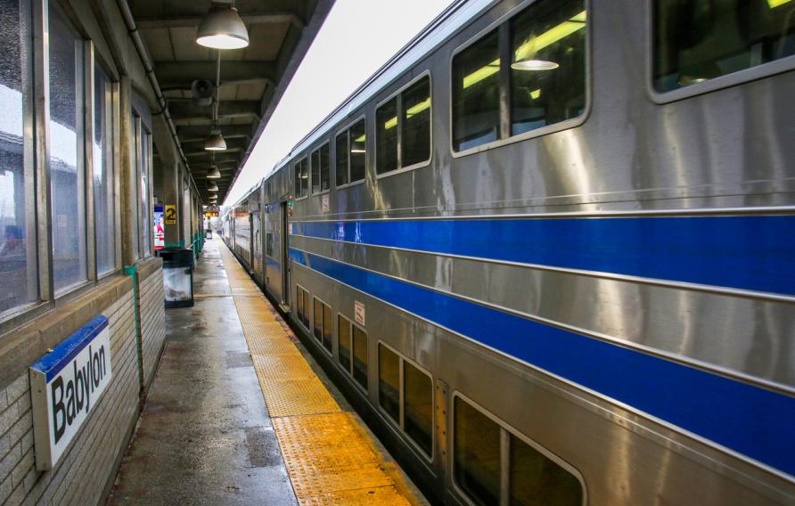 A long Island Railroad Train is arriving from the east at the Babylon Station.