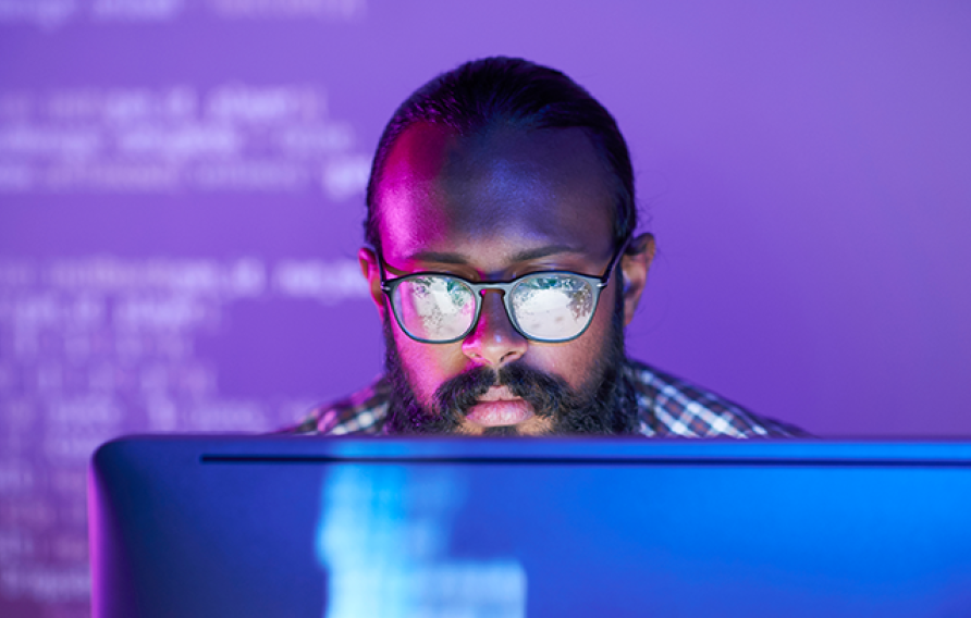 A man looking a a computer screen