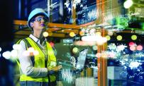 Woman in PPE surrounded by superimposed data