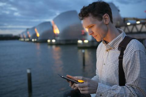 Man on an iPad along the Thames Tideway barriers