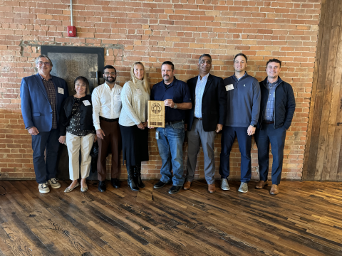 Representatives from our Kansas City office pictured with KC Water staff after accepting our KCIC Sustainability Award