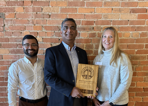 Our local staff accepting the KCIC award. From left to right – Shashi Kambhampati, Rajan Vasudevan, Julie McNiff. Not pictured – everyone else who made this project a huge success!  