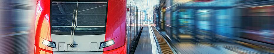 Passenger high speed train moves fast along the railway station platform.