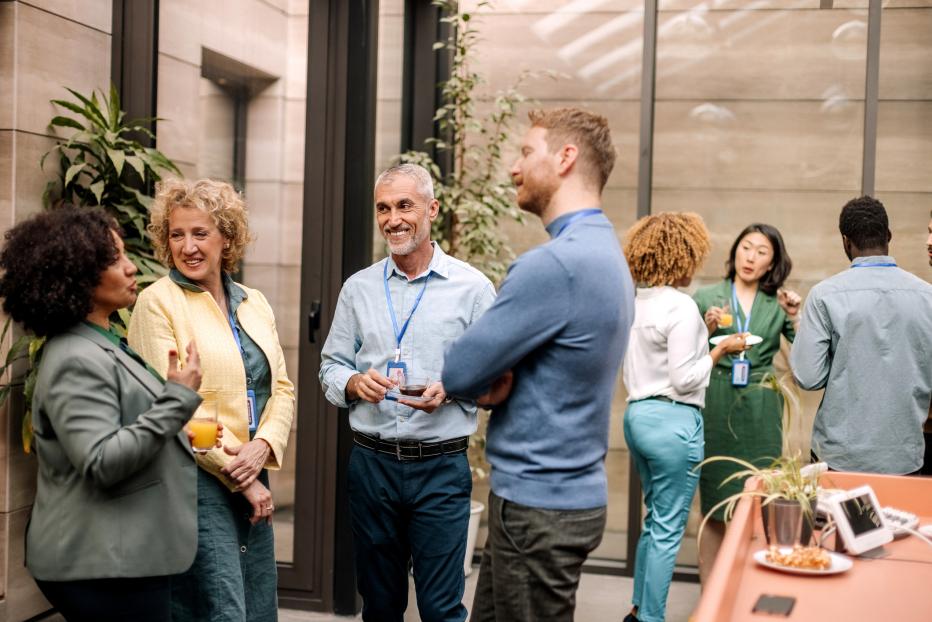 Group of business people having casual conversation while on a refreshment break