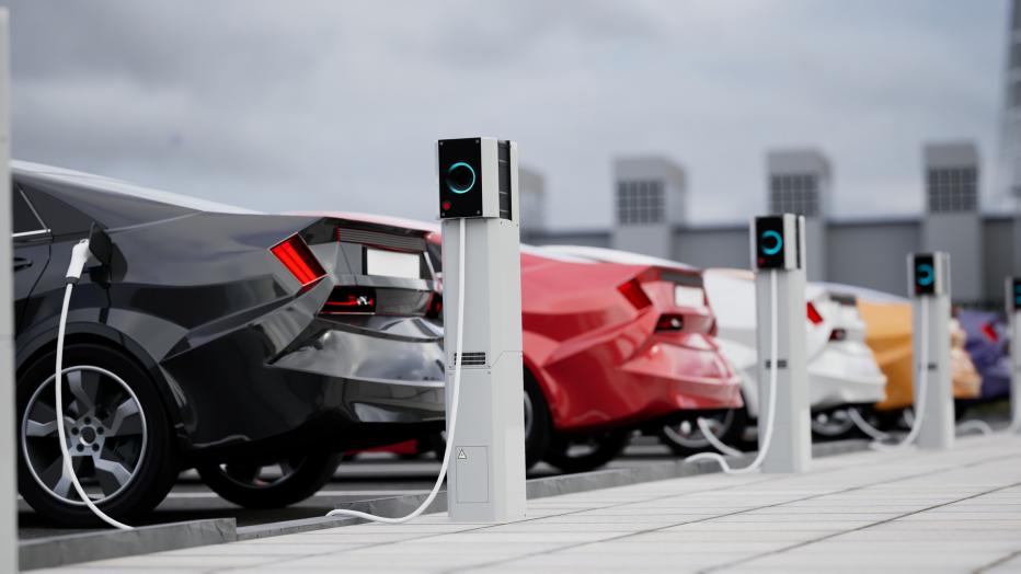 Generic electric car charging on a city street