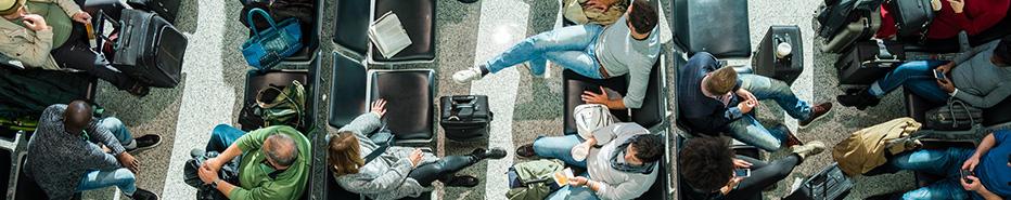 People in a airport gate area, lounging